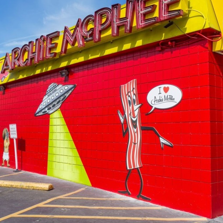 Side of Archie McPhee store with ufo and mr bacon
