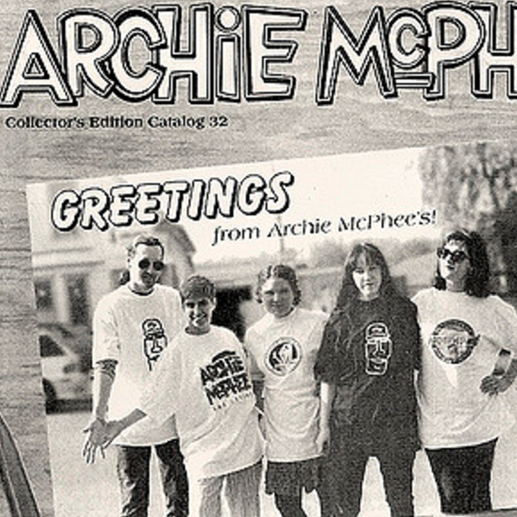 Cover of old archie mcphee catalog featuring staff wearing archie mcphee shirts