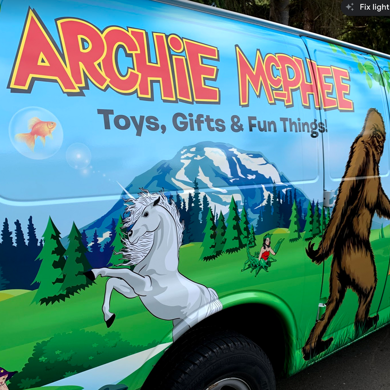 Side of Archie McPhee van with unicorn and bigfoot