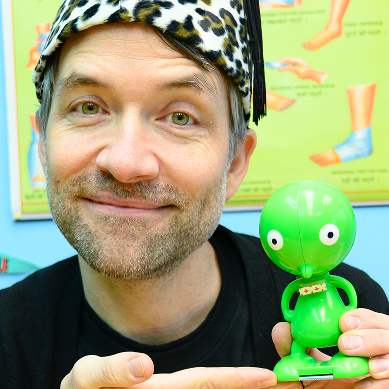 Steve Q with green alien toy