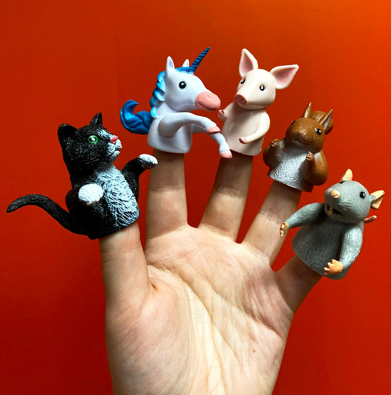 Finger puppets on a hand