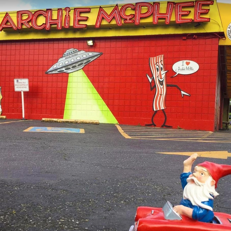 Gnome in car driving by archie mcphee store