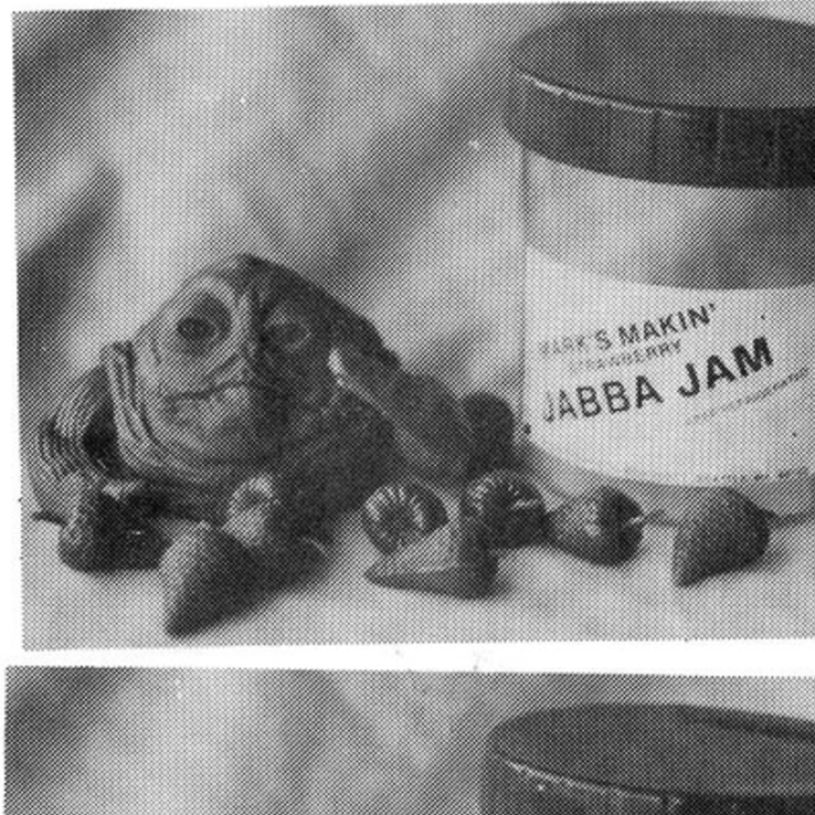 Jabba the hut action figure next to jar