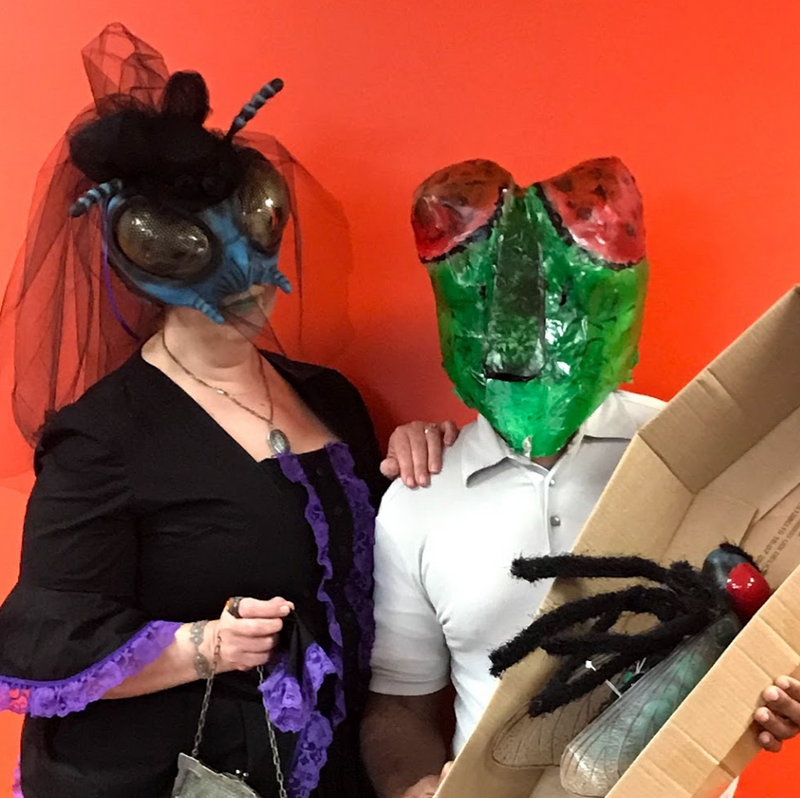 Woman dressed a fly widow with man dressed as fly