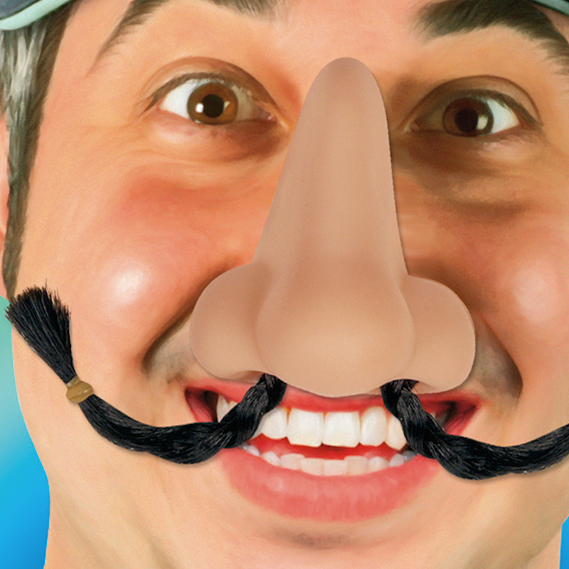 smiling man wearing a fake nose with long hairs