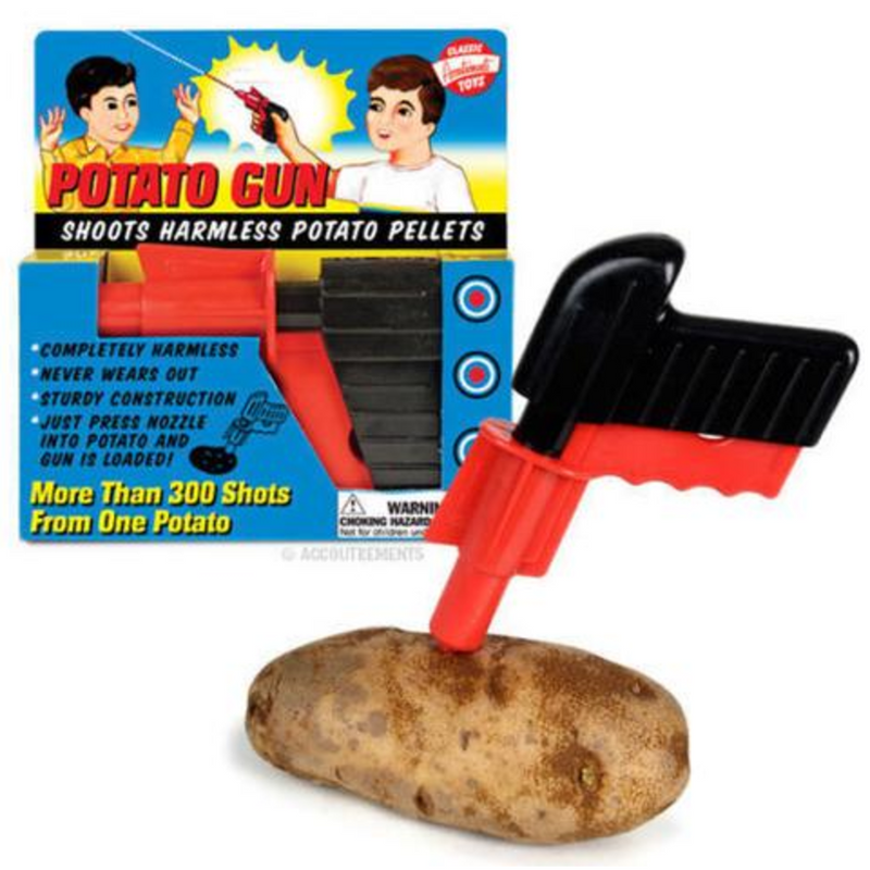 Potato gun stuck in potato in front of package