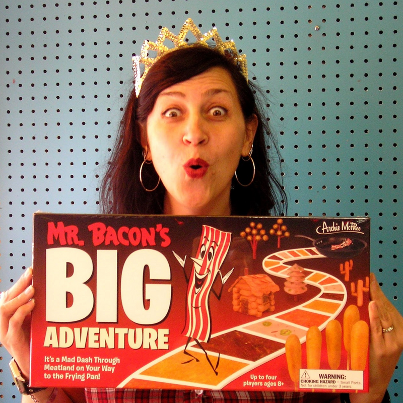 Shana holding Mr. Bacon's big adventures game