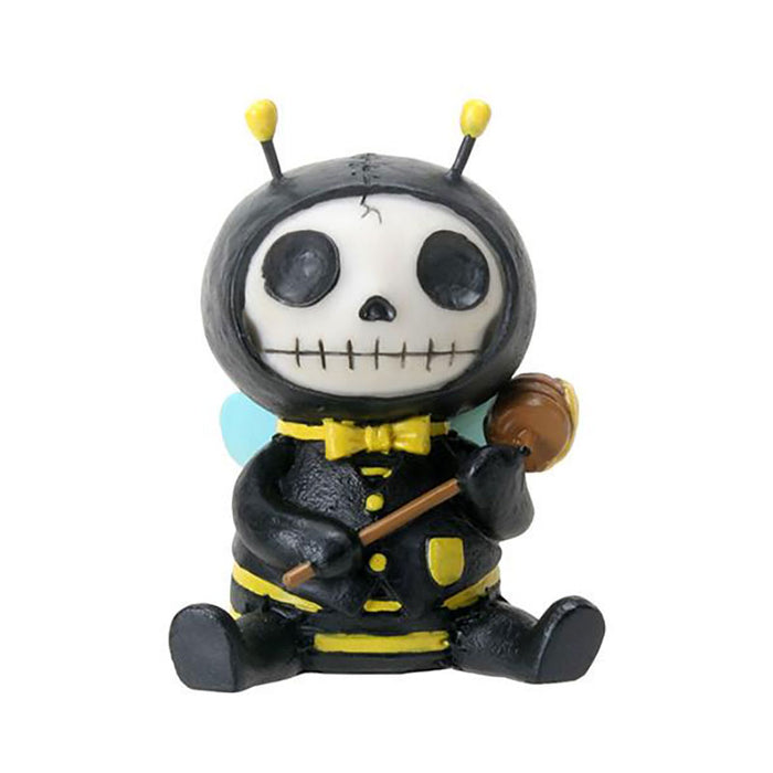 Furrybones Buzz Bumblebee figurine, skeleton in black and yellow bumblebee costume with antennae, holding honey dipper, sitting cross-legged, white skull face with stitched mouth, blue wings, collectible decorative item