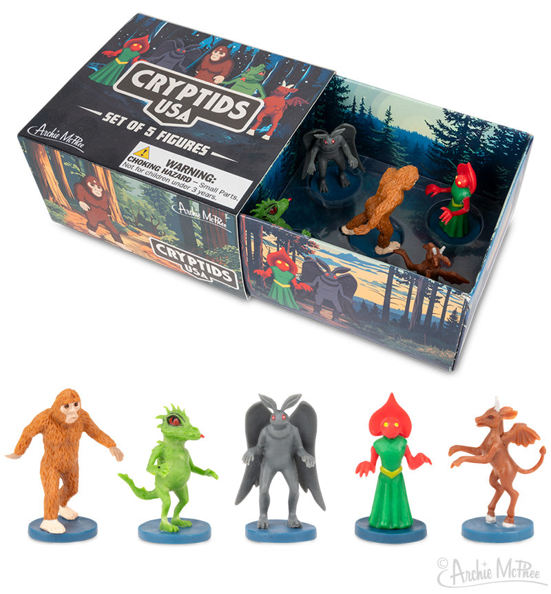 The Cryptids USA box includes five cryptid figures, featuring Bigfoot and the Flatwoods Monster, with a forest-themed design. It's a must-have for enthusiasts of America's legendary monsters.