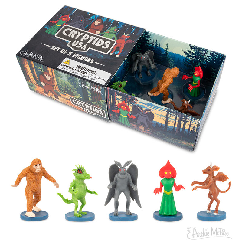 The Cryptids USA box includes five cryptid figures, featuring Bigfoot and the Flatwoods Monster, with a forest-themed design. It's a must-have for enthusiasts of America's legendary monsters.