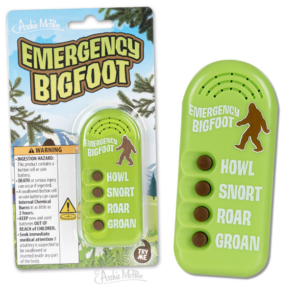 Emergency Bigfoot sound device in packaging, featuring green noisemaker with Bigfoot silhouette and four sound options: howl, snort, roar, groan. Pine tree background and warning label visible on packaging.