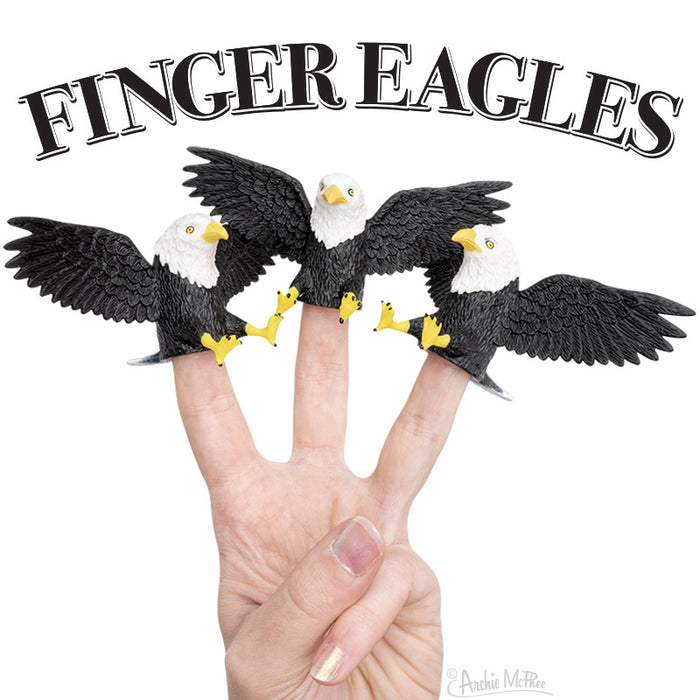 Set of three realistic bald eagle finger puppets with spread wings on a hand making a peace sign, beneath text reading "FINGER EAGLES