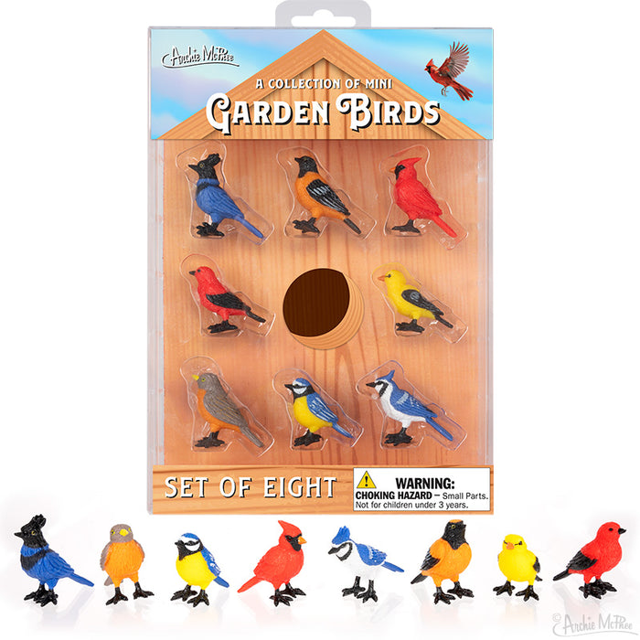 Collection of Mini Garden Birds set featuring 8 colorful vinyl bird figurines in birdhouse-shaped packaging, including Blue Jay, Cardinal, Goldfinch, and other species, with product display and warning label.