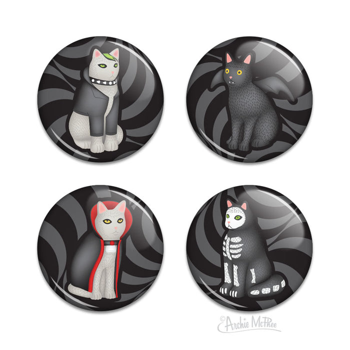 Four pin-back buttons featuring bat cat, emo cat, caped vampire cat and skeleton cat each against a swirling gray and black background.