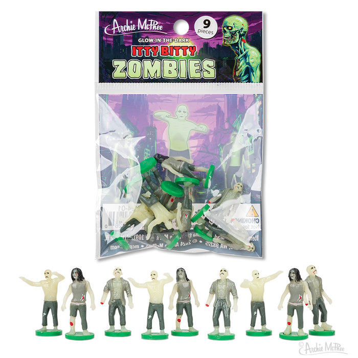 Glow-in-the-dark Itty Bitty Zombies toy set, featuring 9 miniature zombie figurines in various poses, packaged in a clear bag with colorful branding. Below, a lineup of the small zombie figures in different styles on green bases.