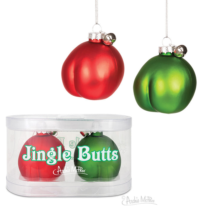 Jingle Butts Christmas ornaments: red and green glass baubles shaped like backsides, with tiny bells attached. Displayed hanging and in clear packaging, these humorous decorations add a cheeky twist to holiday decor.