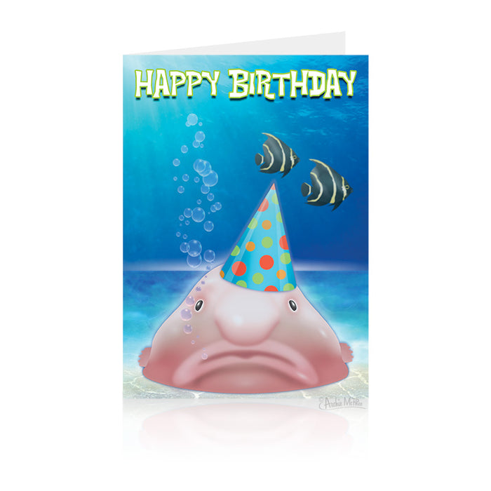 Humorous birthday card featuring a grumpy blobfish wearing a colorful party hat, underwater with bubbles and tropical fish, text reads "Happy Birthday" in playful font