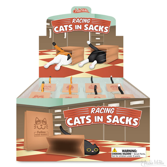 Display box of Racing Cats in Sacks toys showing cat hindquarters in colorful sacks, with product logo and packaging design featuring playful feline racers on a checkered floor