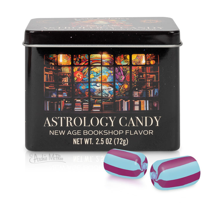 Black tin of Astrology Candy featuring colorful stained glass design depicting mystical elements and bookshelves. Below, two individually wrapped candies with purple and blue stripes, showcasing the product's unique appearance.