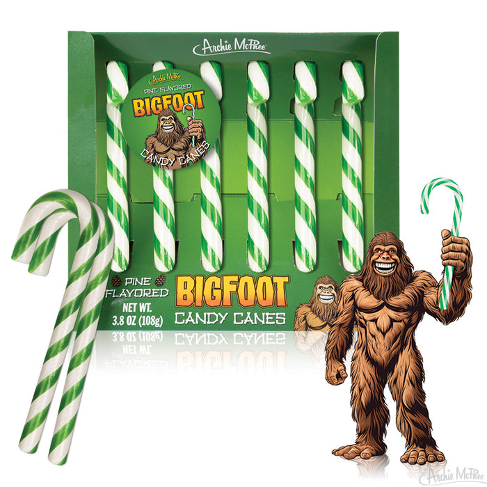 Pine-flavored Bigfoot Candy Canes in green and white stripes, displayed in a festive box with Bigfoot illustrations holding a candy cane, perfect for unique Christmas treats