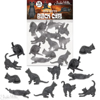 Assortment of 12 miniature black cat figurines in various playful poses, packaged in a clear bag with product label showcasing larger cat silhouette. Cats range from sitting to stretching, with detailed textures visible on their tiny forms.