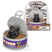 A comedic toy black cat is perched inside a can of Wet Food Joyride, with the packaging in the background showcasing the identical image.