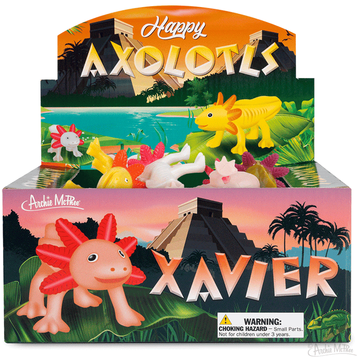 Colorful display box of Happy Axolotls toys featuring smiling axolotl figurines in various colors, set against a tropical backdrop with pyramids and palm trees. Product name and warning label visible on the box.