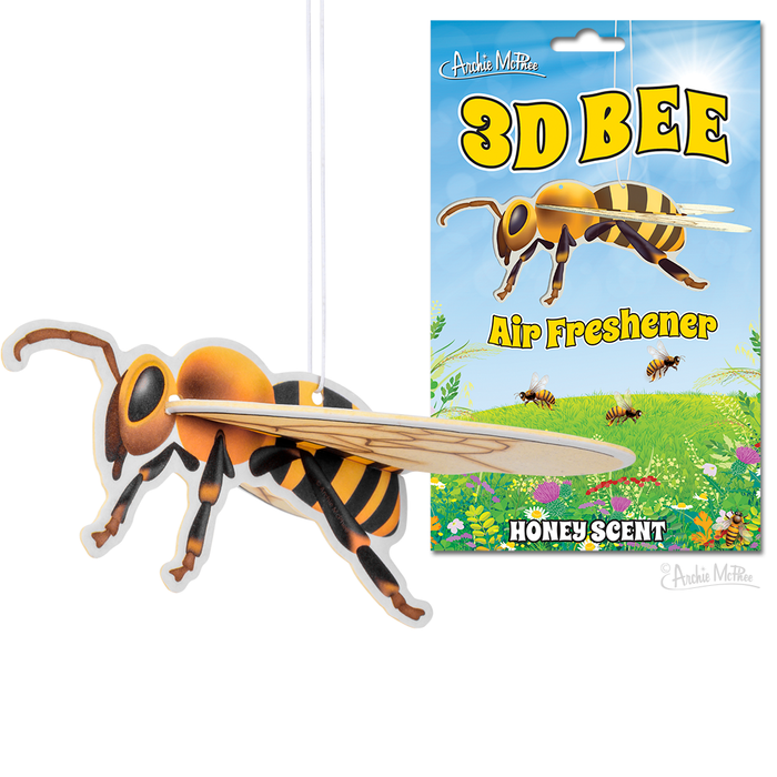 3D bee-shaped air freshener with honey scent, featuring detachable wings and colorful packaging. Product shown hanging and displayed against meadow backdrop. Unique car accessory for bee enthusiasts and nature lovers.