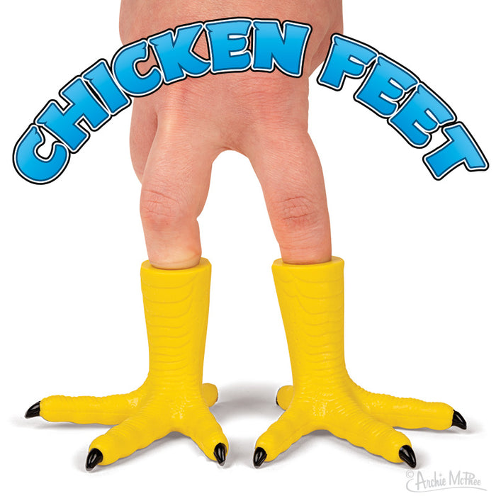 Two bright yellow chicken feet finger puppets worn on human fingers, with blue text "CHICKEN FEET" arching over them, showcasing the quirky and fun nature of the product