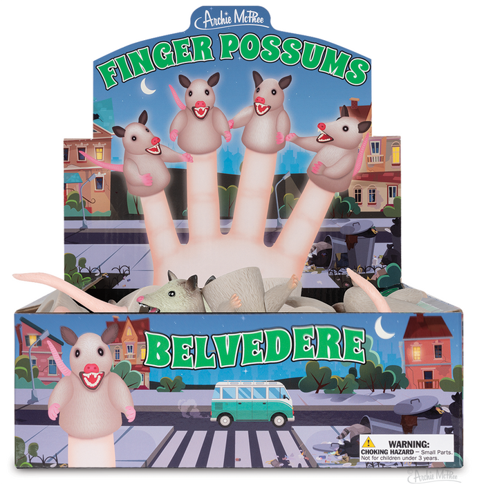 Display box of Finger Possums puppets featuring cartoon possums on fingers against a nighttime cityscape backdrop. Colorful packaging shows possum characters and urban scenery with houses, streets, and a van.