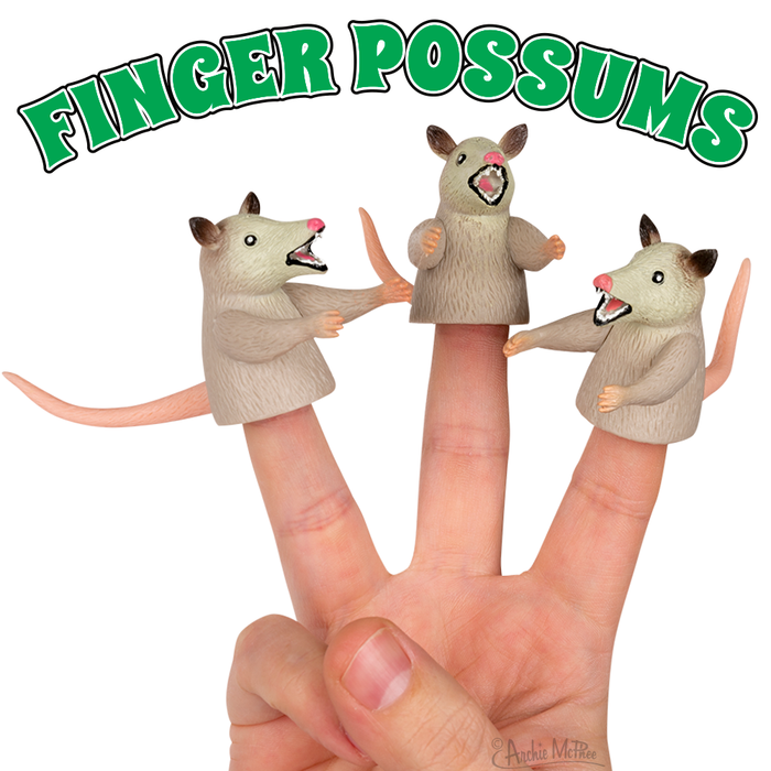 Set of three possum finger puppets worn on hand, showing playful expressions with open mouths and raised arms, under green text reading "FINGER POSSUMS