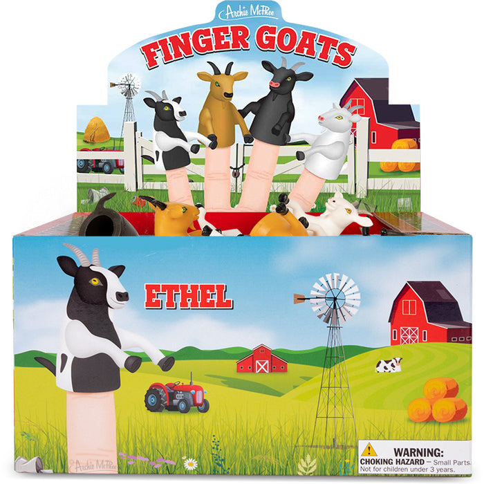 Colorful display box of Finger Goats toys featuring miniature goat puppets on fingers, set against a farm backdrop with barn, windmill, and tractor. Includes various goat colors and farm-themed illustrations, emphasizing the playful and rural nature of the product.