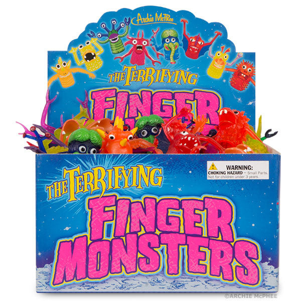 Colorful display box of Terrifying Finger Monsters toy set featuring assorted miniature rubber monster characters in vibrant colors, designed for finger puppet play, with warning label for choking hazard