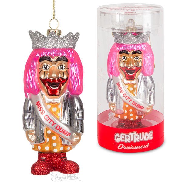 Gertrude Ornament from J.P. Patches Show, featuring colorful glass figurine with pink hair, silver crown, and polka dot dress. Displayed both as hanging ornament and in clear packaging labeled 'Gertrude Ornament'. Vibrant collectible for fans of Seattle's beloved children's TV program.