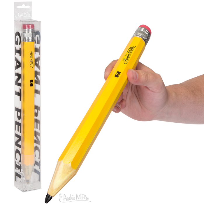 Giant yellow wooden pencil with red eraser, held in hand, next to its clear packaging. Oversized writing instrument for novelty and functionality, perfect for big ideas and desk decor.