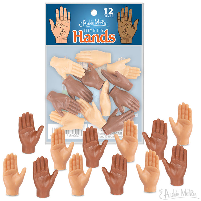 Bag of 12 miniature vinyl hands in diverse skin tones, packaged in clear plastic with blue-labeled header, displayed with hands arranged below package showcasing various gestures and colors