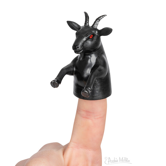 Black vinyl goat finger puppet with red eyes and horns, worn on a finger, creepy and demonic appearance for Halloween or dark humor, 2 inches tall, soft material