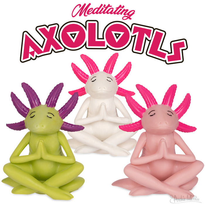 Three colorful axolotl figurines in meditation poses: green, white, and pink. They sit cross-legged with hands together, eyes closed, and serene expressions. Text above reads "Meditating Axolotls" in pink lettering.