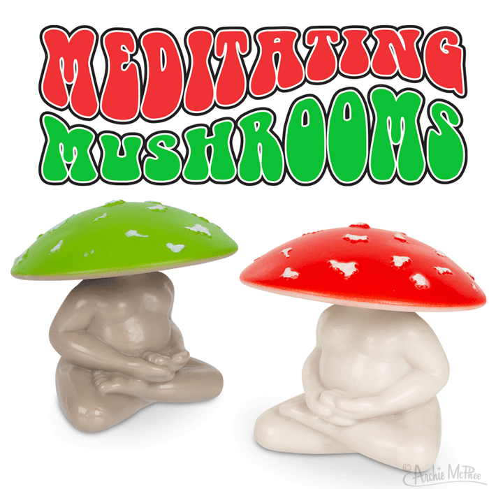 Colorful "Meditating Mushrooms" product image featuring two vinyl collectible figures with red and green caps, sitting in meditation poses, ideal for goblincore enthusiasts and forest-inspired decor lovers.