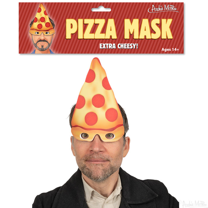 Realistic pizza slice mask worn by adult, packaged as 'Pizza Mask' product, labeled 'Extra Cheesy' and suitable for ages 14+, showcasing triangular pizza-shaped headpiece with pepperoni design