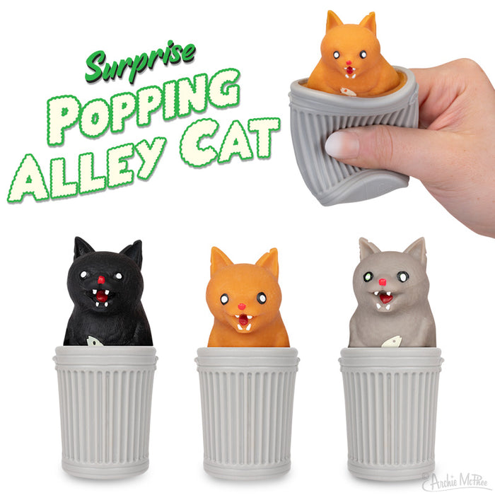 Surprise Popping Alley Cat toy featuring orange, black, and gray cats in mini trash cans. Hand demonstrating pop-up action with orange cat. Product title in green text. Novelty gift for cat lovers and pranksters.