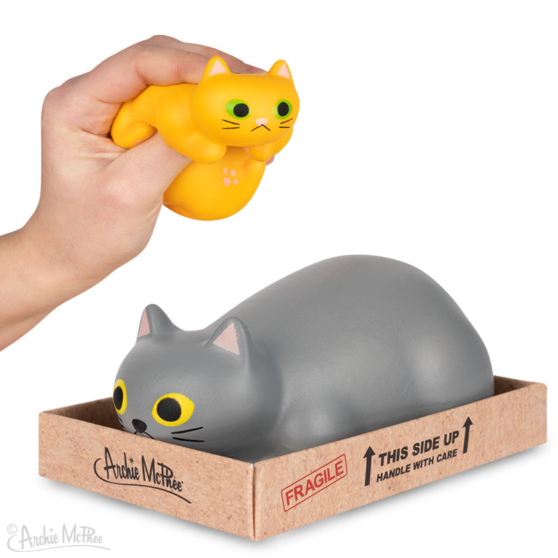 Orange and Gray Purrrly Stress Kitty shown squished and in box