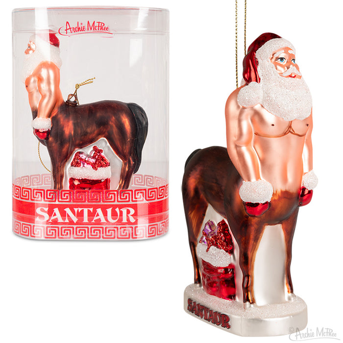 Santaur Ornament: Unique glass Christmas decoration featuring a muscular half-Santa, half-horse creature with defined abs, carrying a sack of toys. Displayed in packaging and as standalone ornament with festive details.