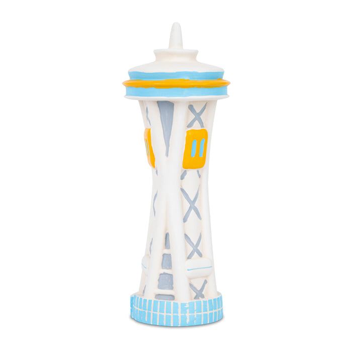 Squeaky Space Needle dog toy, white and blue with yellow accents, stylized replica of Seattle's iconic landmark, designed for pets but appealing to monument enthusiasts