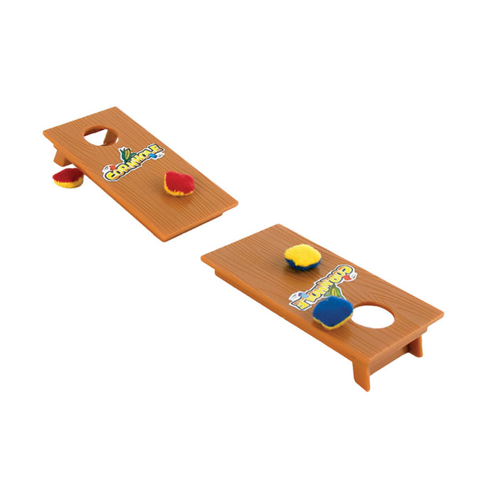 Miniature cornhole game set with two wooden boards featuring colorful graphics, small holes, and tiny bean bags in red, yellow, and blue, perfect for desktop or travel play