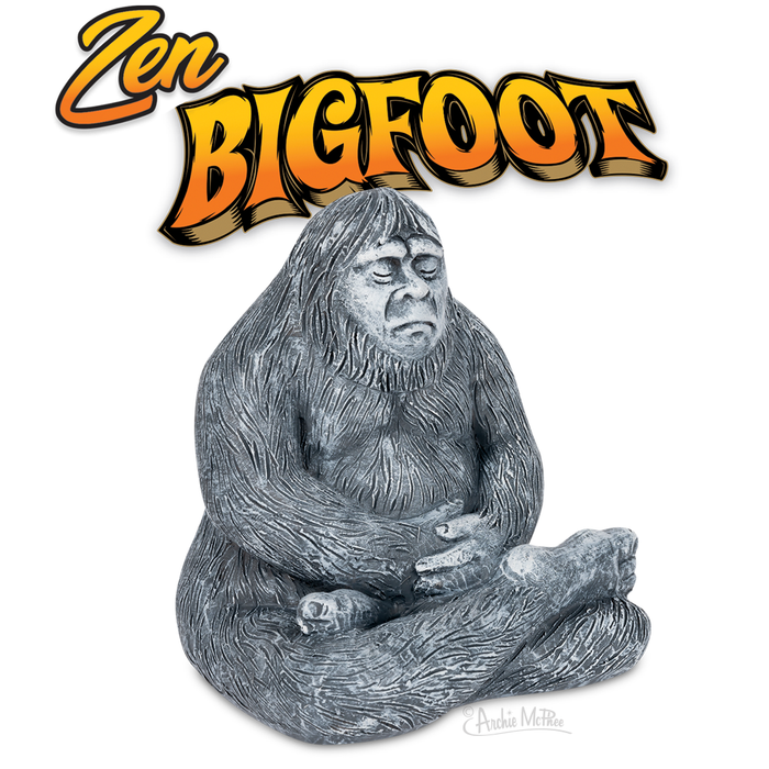 Zen Bigfoot statue in meditation pose, gray polystone figure with eyes closed and hands resting, beneath colorful orange and yellow text logo