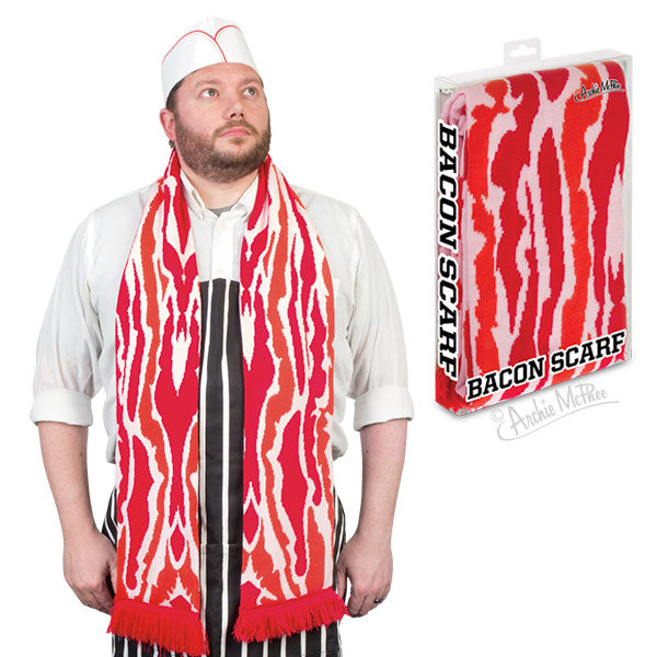 Person wearing a white shirt and a long red and white scarf designed to look like bacon strips. Product packaging for Bacon Scarf visible, showing the scarf's bacon-like pattern.