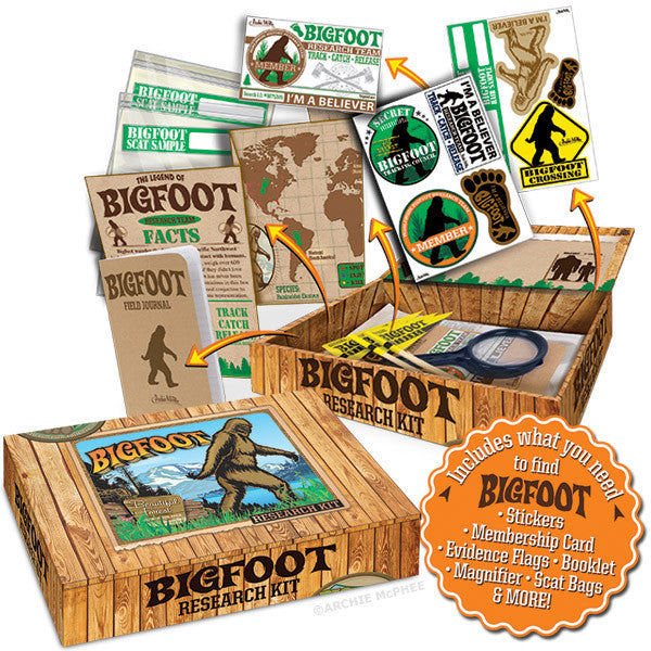 Bigfoot Research Kit contents displayed, including map, stickers, booklet, magnifier, and evidence flags, with decorated boxes showcasing Bigfoot illustrations and product details