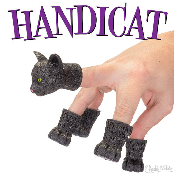 Black cat finger puppet set with head and paw covers, transforming a hand into a realistic feline appearance. Product name "Handicat" displayed in purple text above the image.