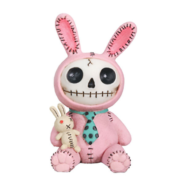 Furrybones Bun Bun Bunny figurine, a skeleton in pink rabbit costume with long ears, holding a small white bunny toy. Features a skull face, stitched details, and blue polka dot tie. Cute and spooky collectible Easter decoration.